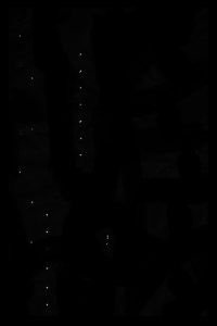 Black screen with white dots. The texture hides things. The eyes are always there, even if you don't want them to be.